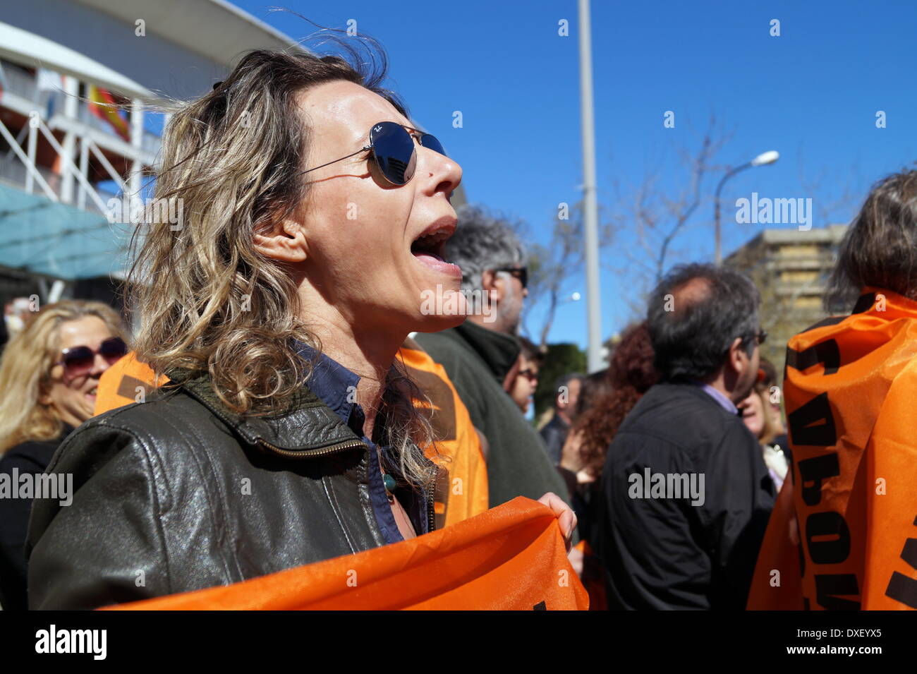 Thessaloniki, Greece. 25th March 2014. Schoolteachers chant anti-austerity slogans during the Greek independence day parade on Tuesday, in the northern port city of Thessaloniki, Greece's second largest city. Greeks celebrated their national independence day amid tight security and protest in the northern port city of Thessaloniki, as school teachers staged a protest against planned layoffs as part of governments cost cutting reforms.  Credit:  Orhan Tsolak/Alamy Live News Stock Photo