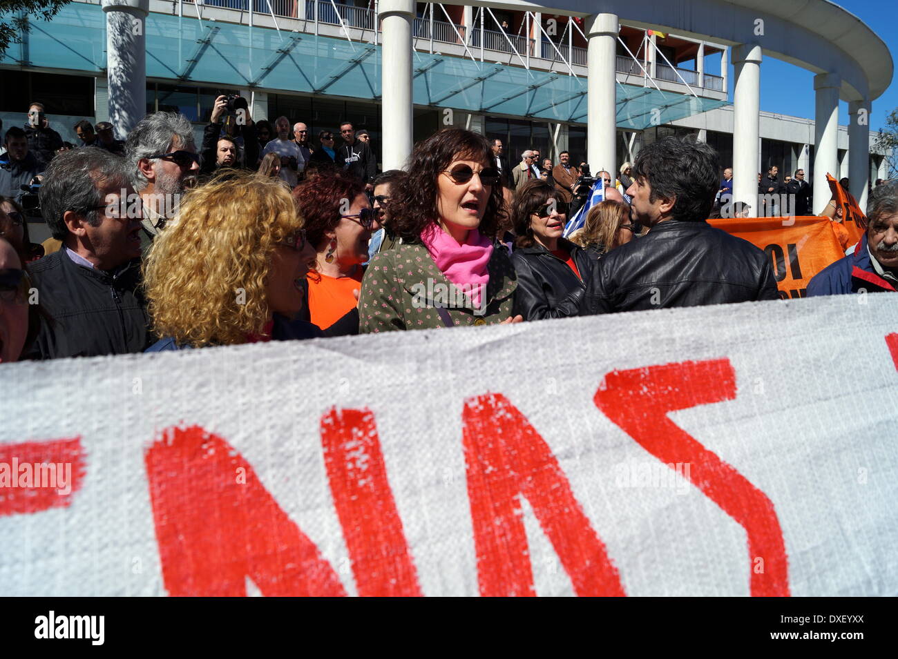 Thessaloniki, Greece. 25th March 2014. Schoolteachers chant anti-austerity slogans during the Greek independence day parade on Tuesday, in the northern port city of Thessaloniki, Greece's second largest city. Greeks celebrated their national independence day amid tight security and protest in the northern port city of Thessaloniki, as school teachers staged a protest against planned layoffs as part of governments cost cutting reforms.  Credit:  Orhan Tsolak/Alamy Live News Stock Photo