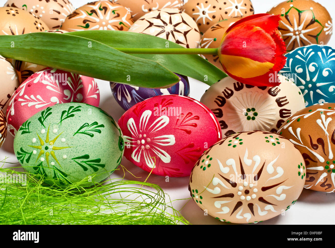 painted Easter eggs with a red tulip Stock Photo - Alamy