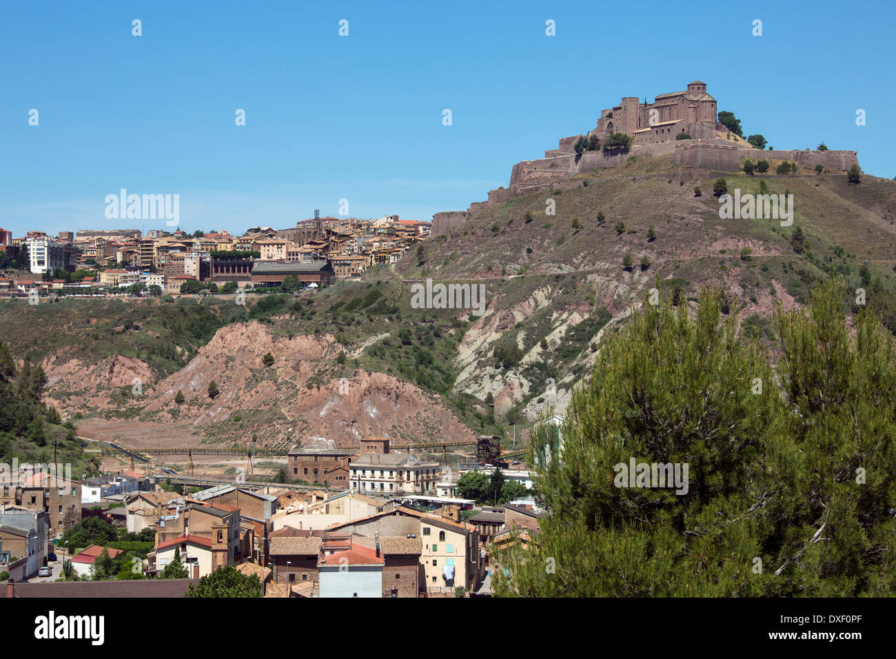 Cardona Castle and Abbey high above the industrial town of Cardona in the Catalonia region of Spain. Stock Photo