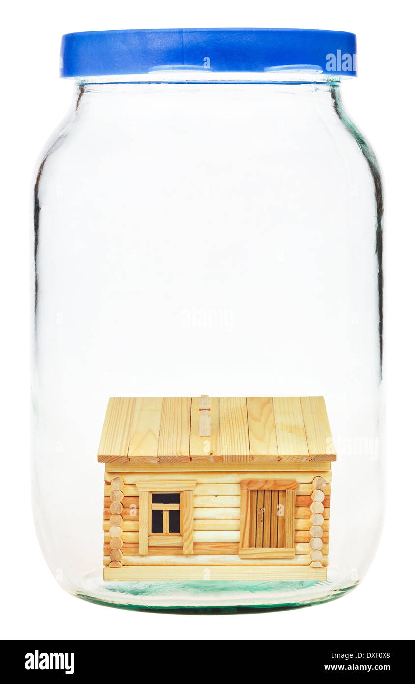 new wooden village house in closed glass jar Stock Photo