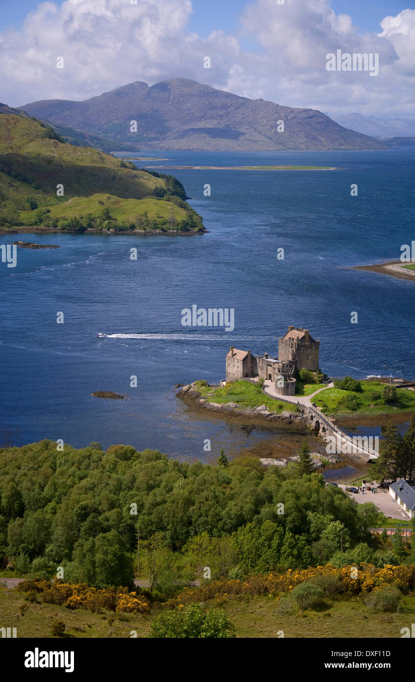 Portrait view of Eilan Donan with speedboat Stock Photo