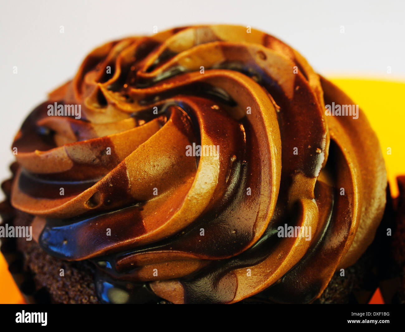 Close Up Of Single Chocolate Cupcake With Icing Stock Photo
