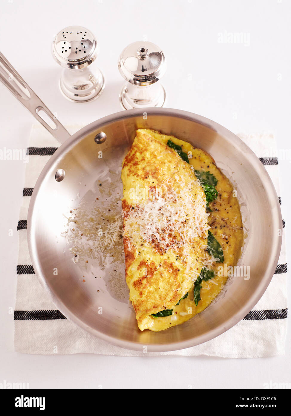 Overhead View of Omelette in Frying Pan with Salt and Pepper, Studio