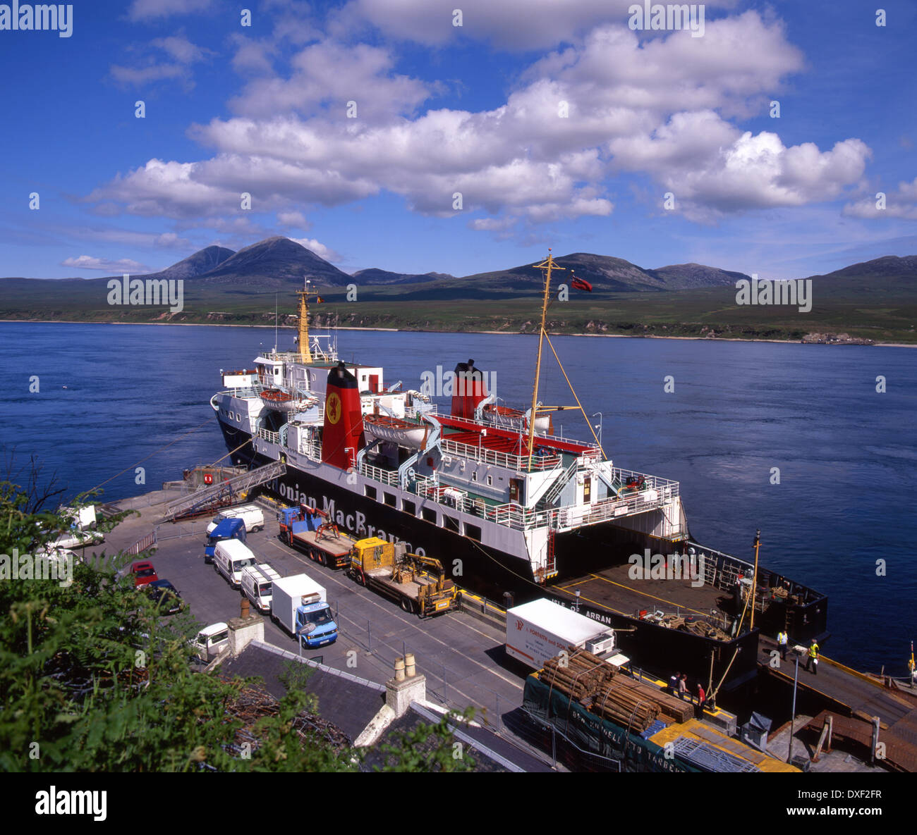 The M.V.Isle of Arran unloading at Port Askaig, Islay with the Paps of Jura in view, Argyll Stock Photo