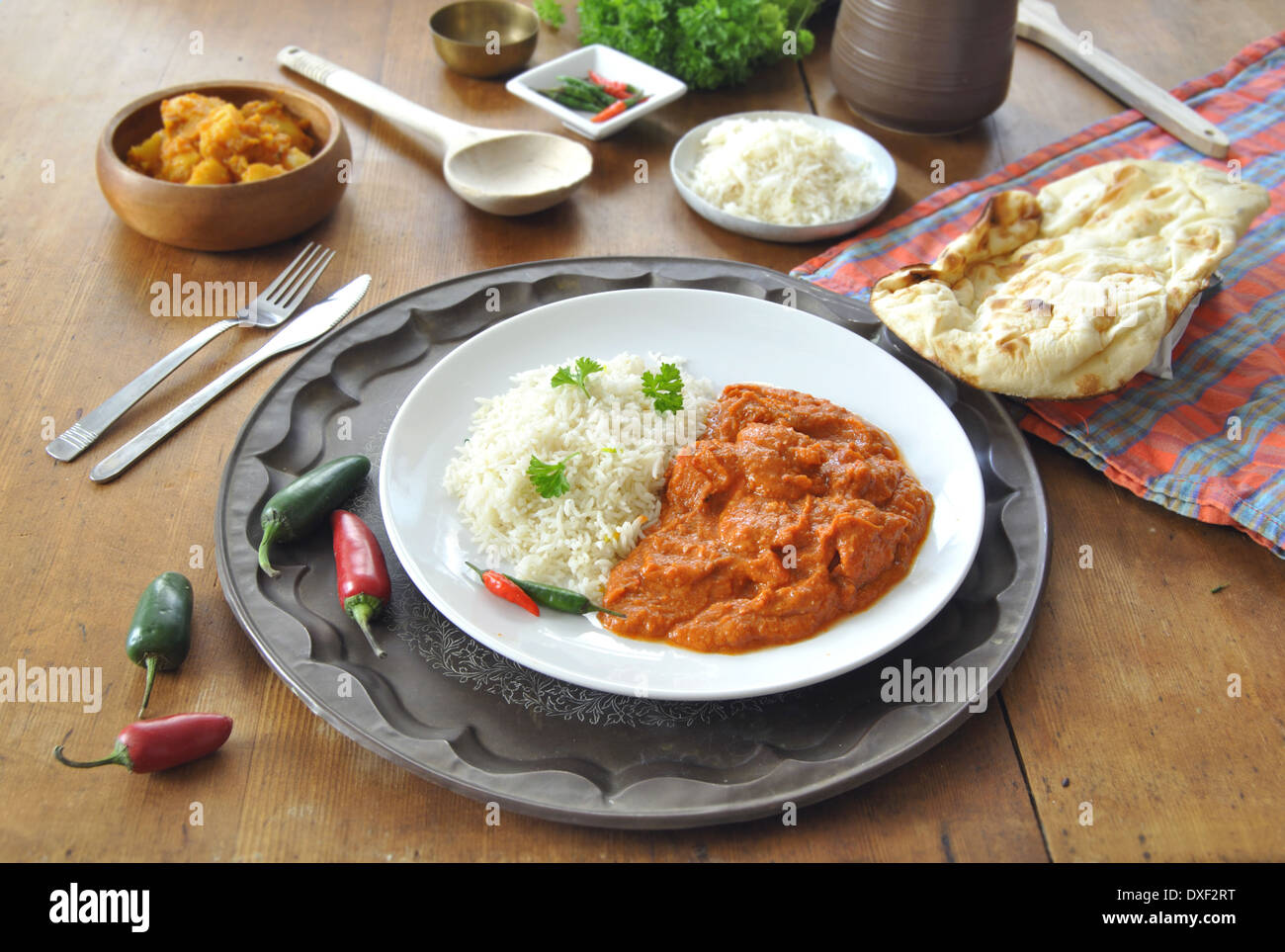 Chicken curry on a plate with rice an chilli pepper Stock Photo