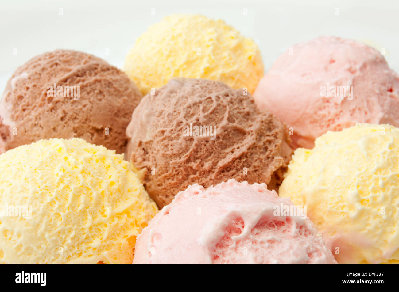 Icecream scoops with chocolate, vanilla and strawberry flavors Stock Photo