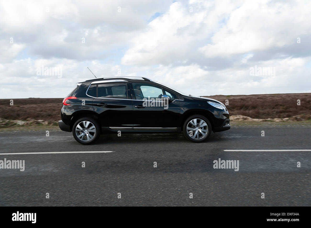 2014 Peugeot 2008 HDi Feline driving on country road Stock Photo