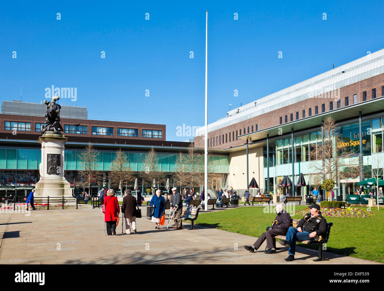 People sat in Eldon Square Shopping centre gardens Newcastle upon tyne tyne and wear tyneside