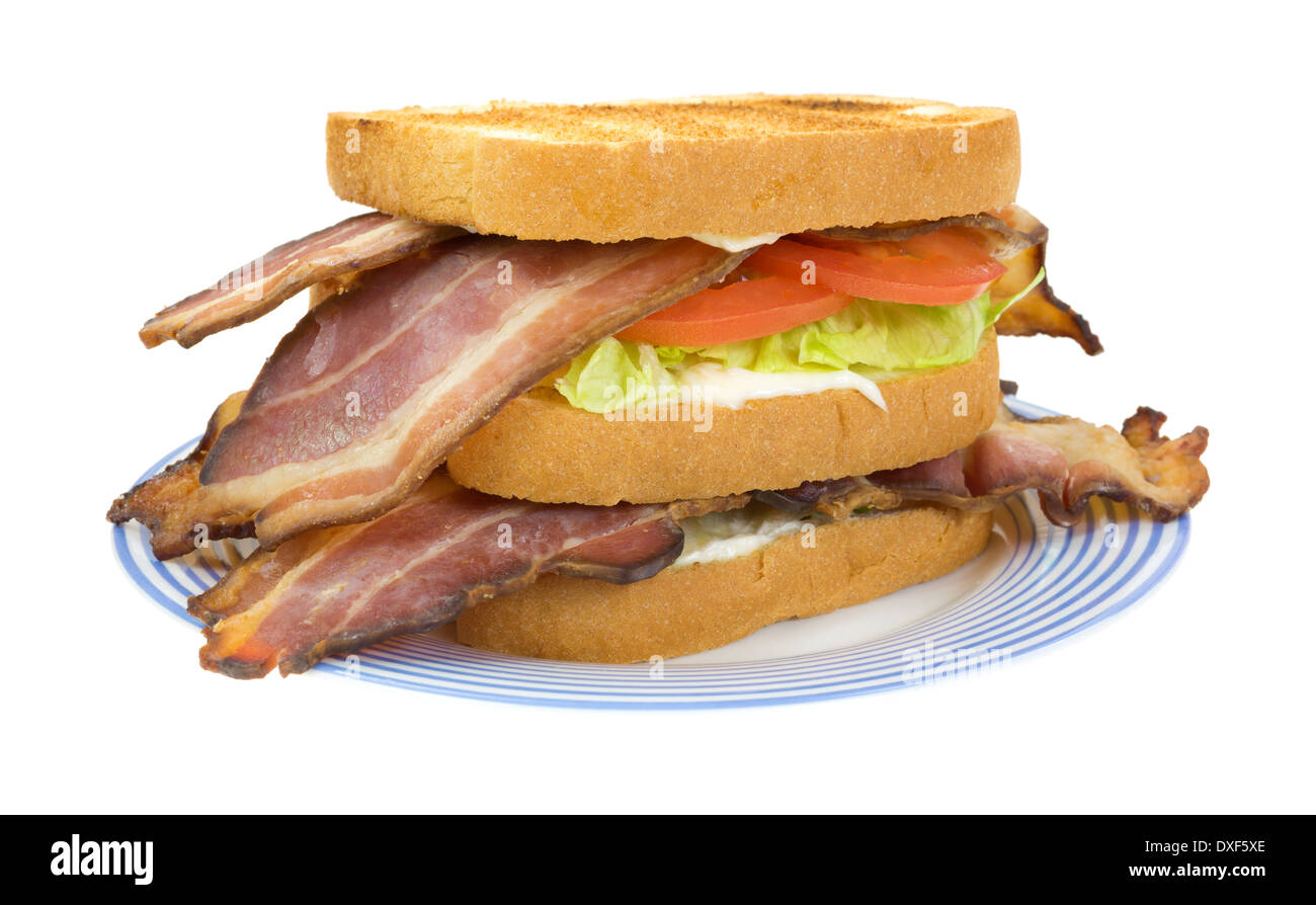 A large bacon lettuce and tomato sandwich on a blue striped plate. Stock Photo