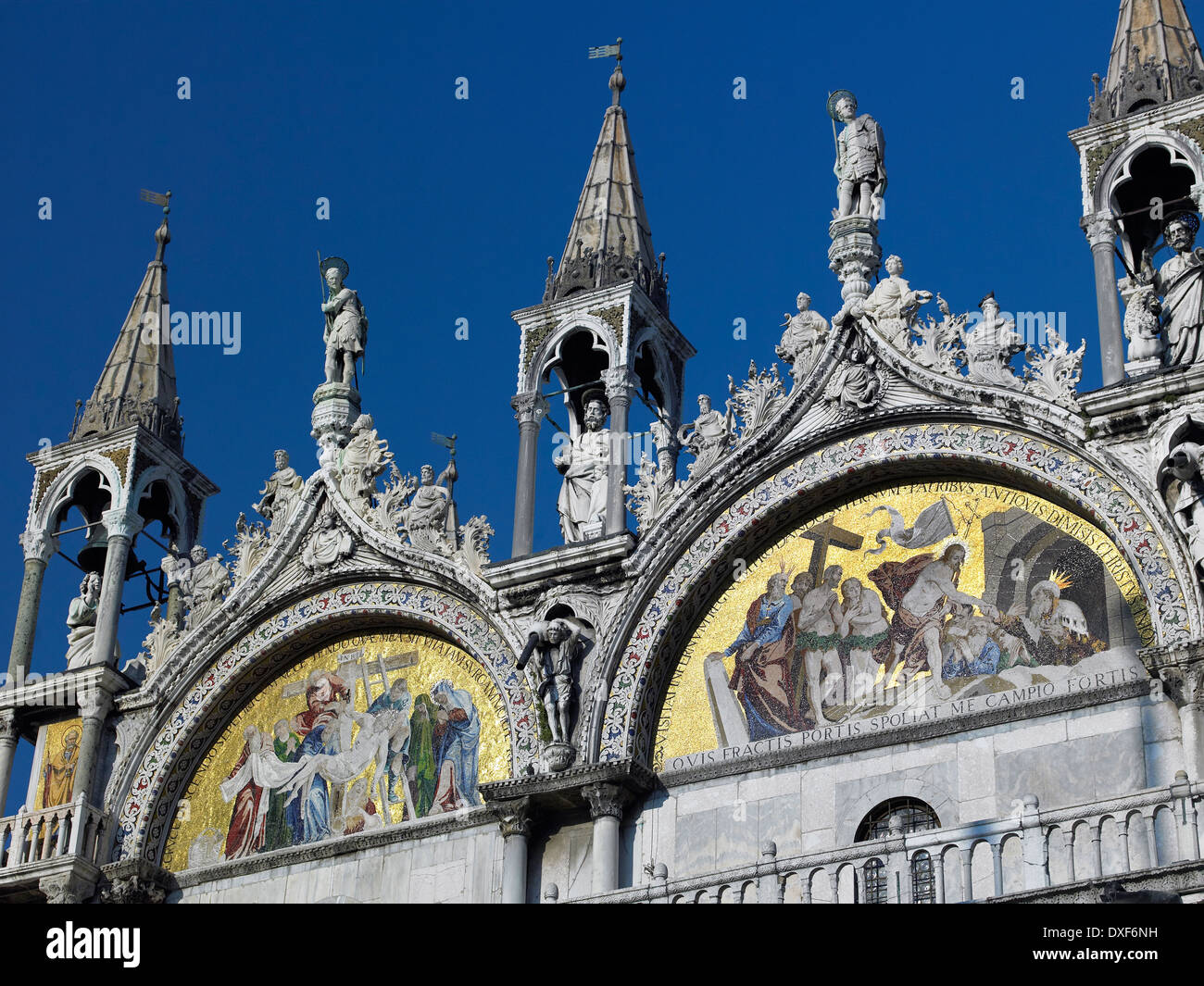 Fine mosaics and detailed statues on the Basilica in St Marks Square in Venice. Italy Stock Photo