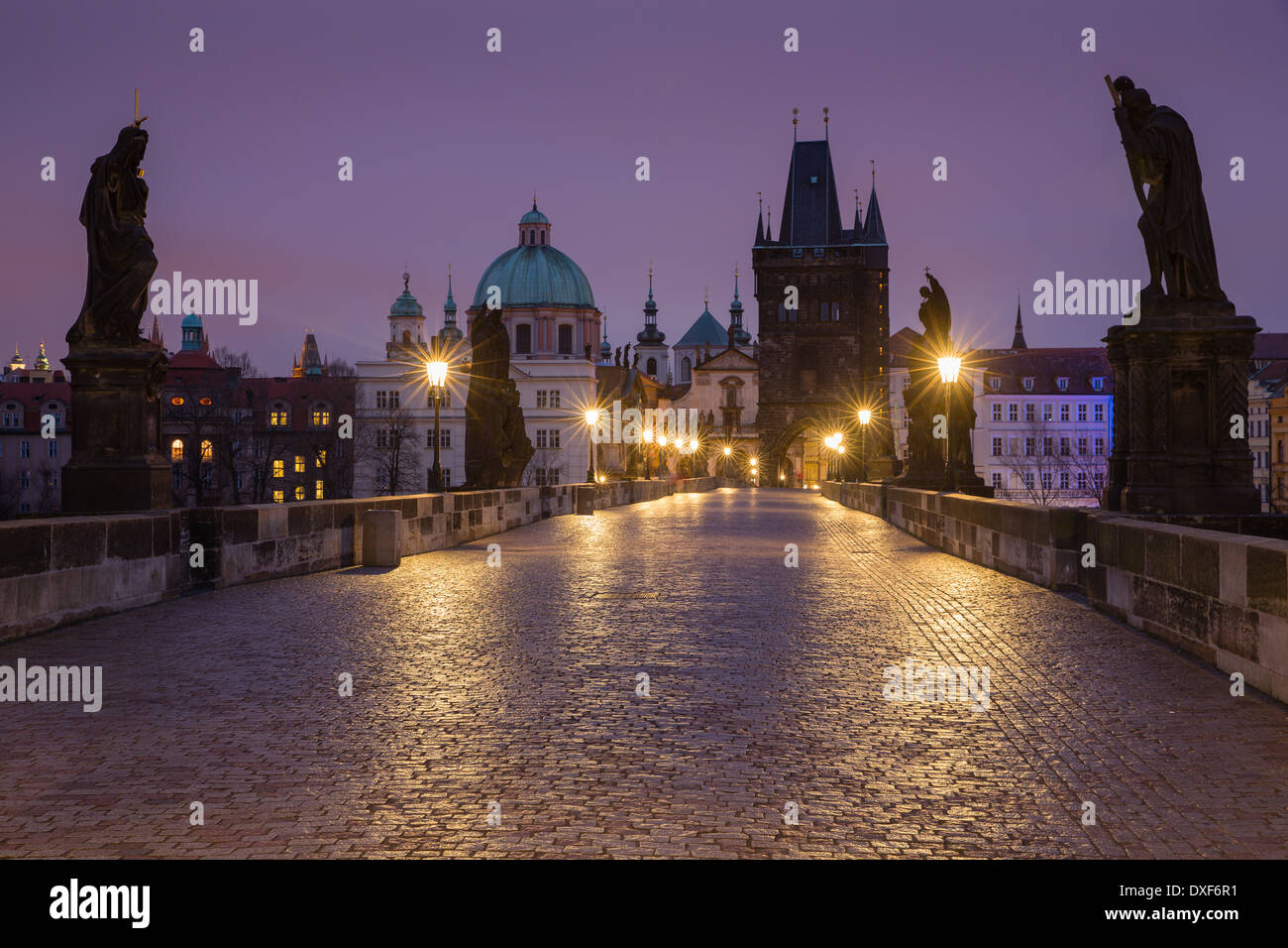 dawn on the Charles Bridge with the towers and spires of the Old Town beyond, Prague, Czech Republic Stock Photo