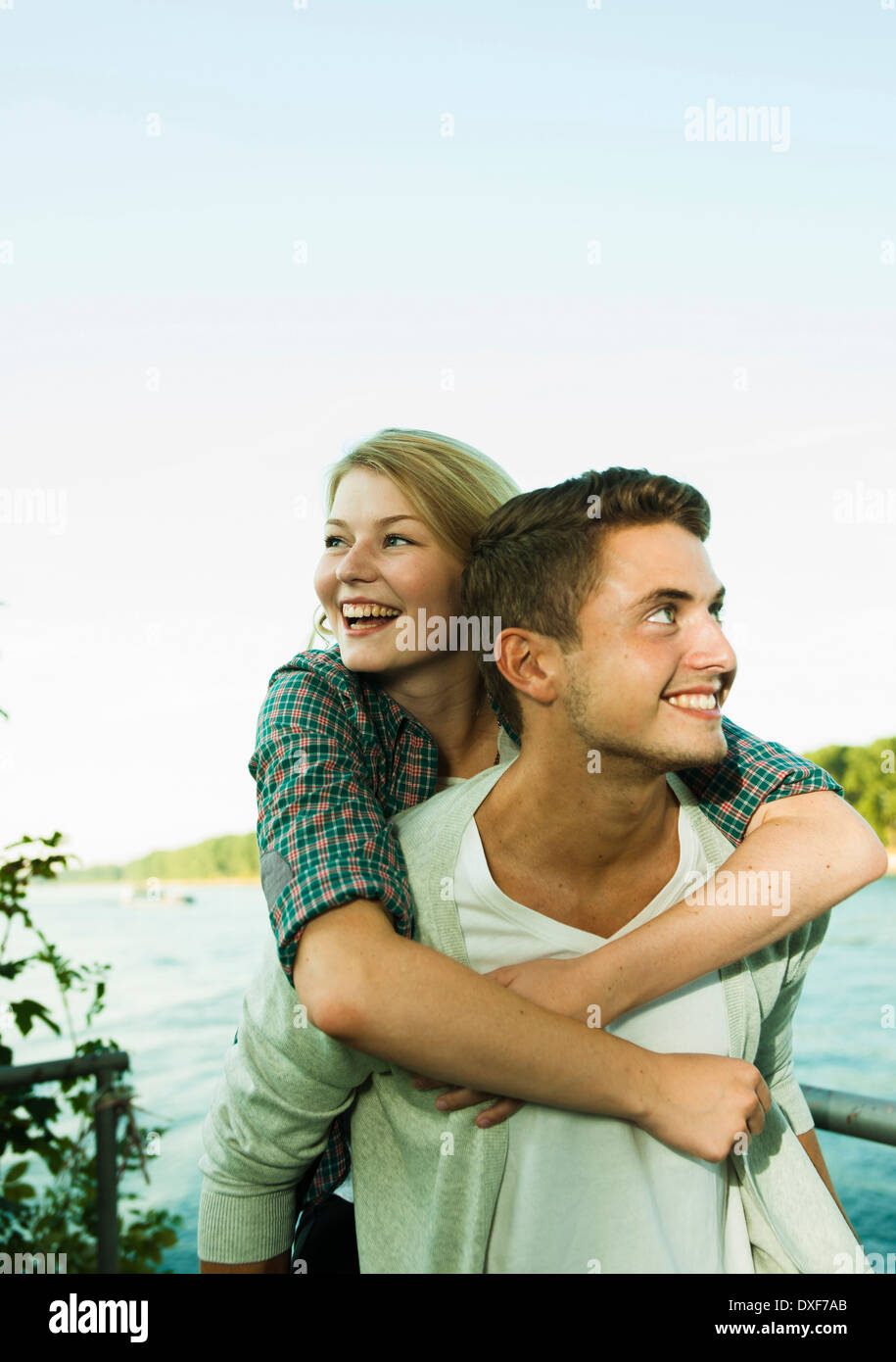 Young Man giving Young Woman Piggyback Ride, Mannheim, Baden-Wurttermberg, Germany Stock Photo