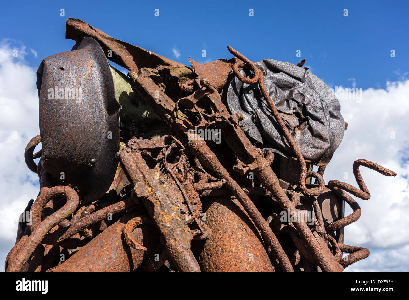 Compressed and twisted metal of WWI remnants like rifles, helmets near the IJzertoren / Yser Tower, Diksmuide / Dixmude, Belgium Stock Photo