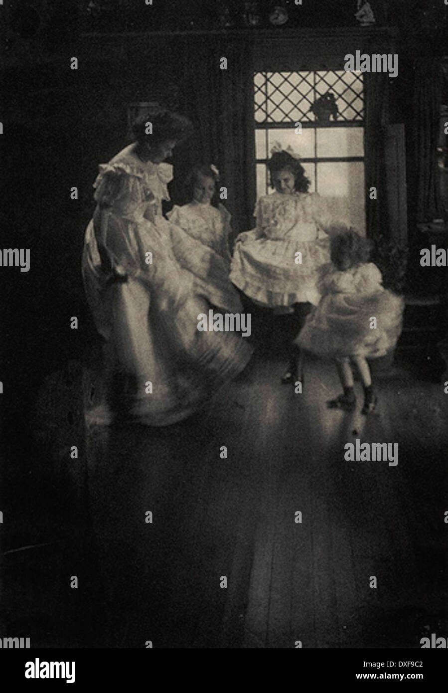 A vintage photo capturing a dancing school from past times, showcasing students engaged in lessons. This image offers a glimpse into historical educational practices related to dance and social gatherings. Stock Photo