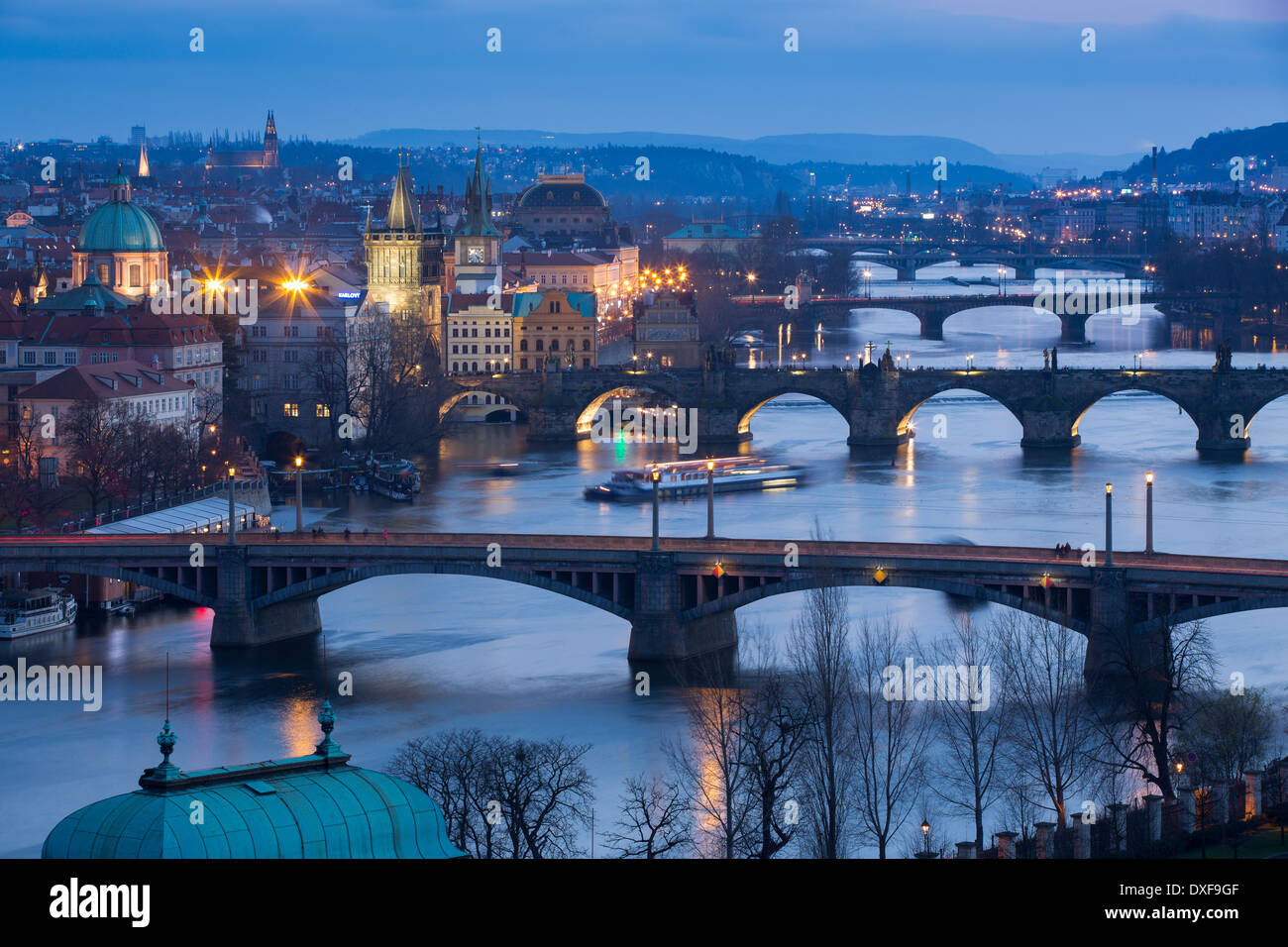 the Manes, Charles and Legion Bridges over the Vltava River at dusk, with the Old Town on the left, Prague, Czech Republic Stock Photo