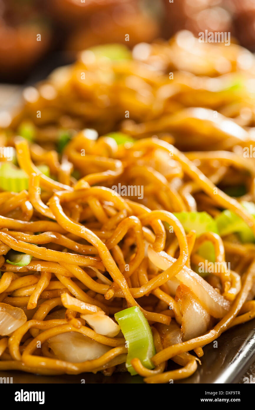 Asian Chow Mein Noodles with Vegetables and Chopsticks Stock Photo
