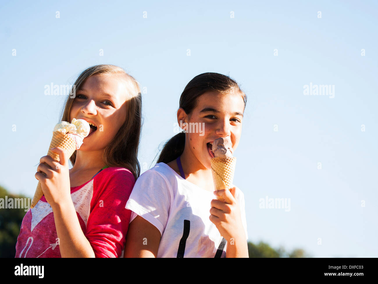 Girls eating Ice Cream Cones, Lampertheim, Hesse, Germany Stock Photo