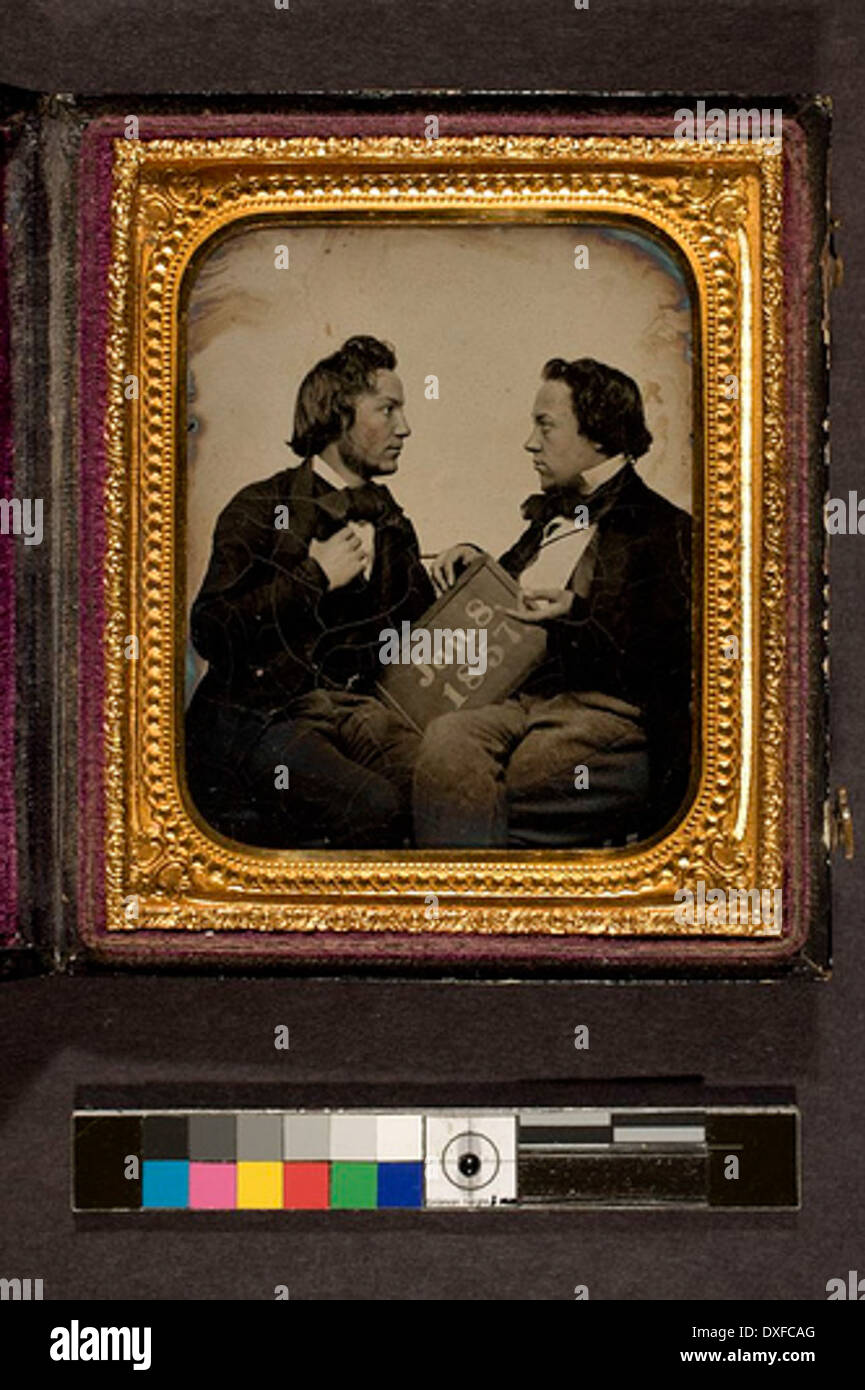 portrait of 2 men holding slate, upon which is written the date, Jan. 8, 1857 portrait of two men holding slate, upon which is written the date, Jan. 8, 1857 Stock Photo