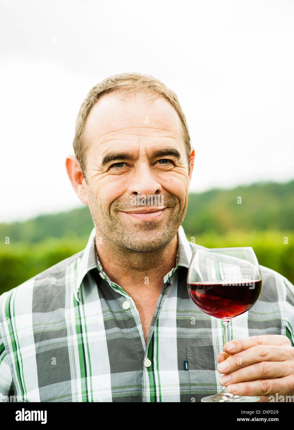 Close up smiling standing looking at camera holding food and drink hi