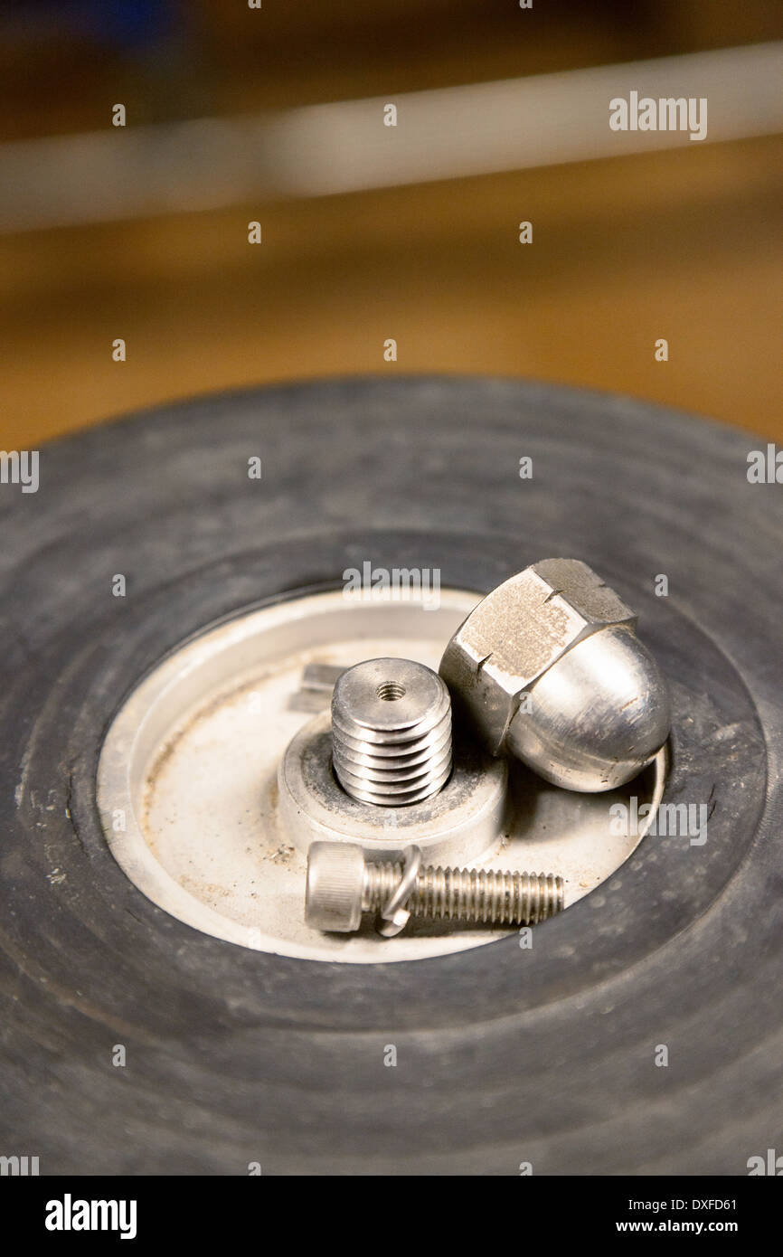 Nuts and bolts on a factory machine machinery Stock Photo