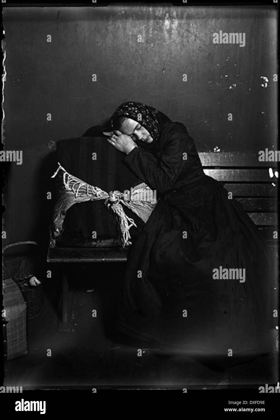 Slovak Woman Immigrant Taking Nap In Baggage 1905 Stock Photo