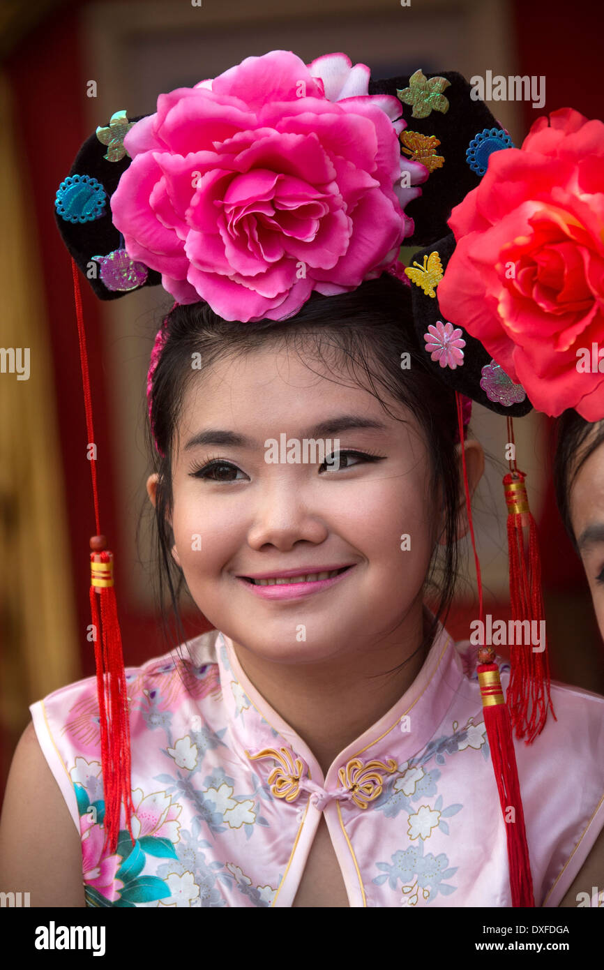 Young Thai girl at the Chinese New Year celebrations in Chinatown in Bangkok in Thailand. Stock Photo