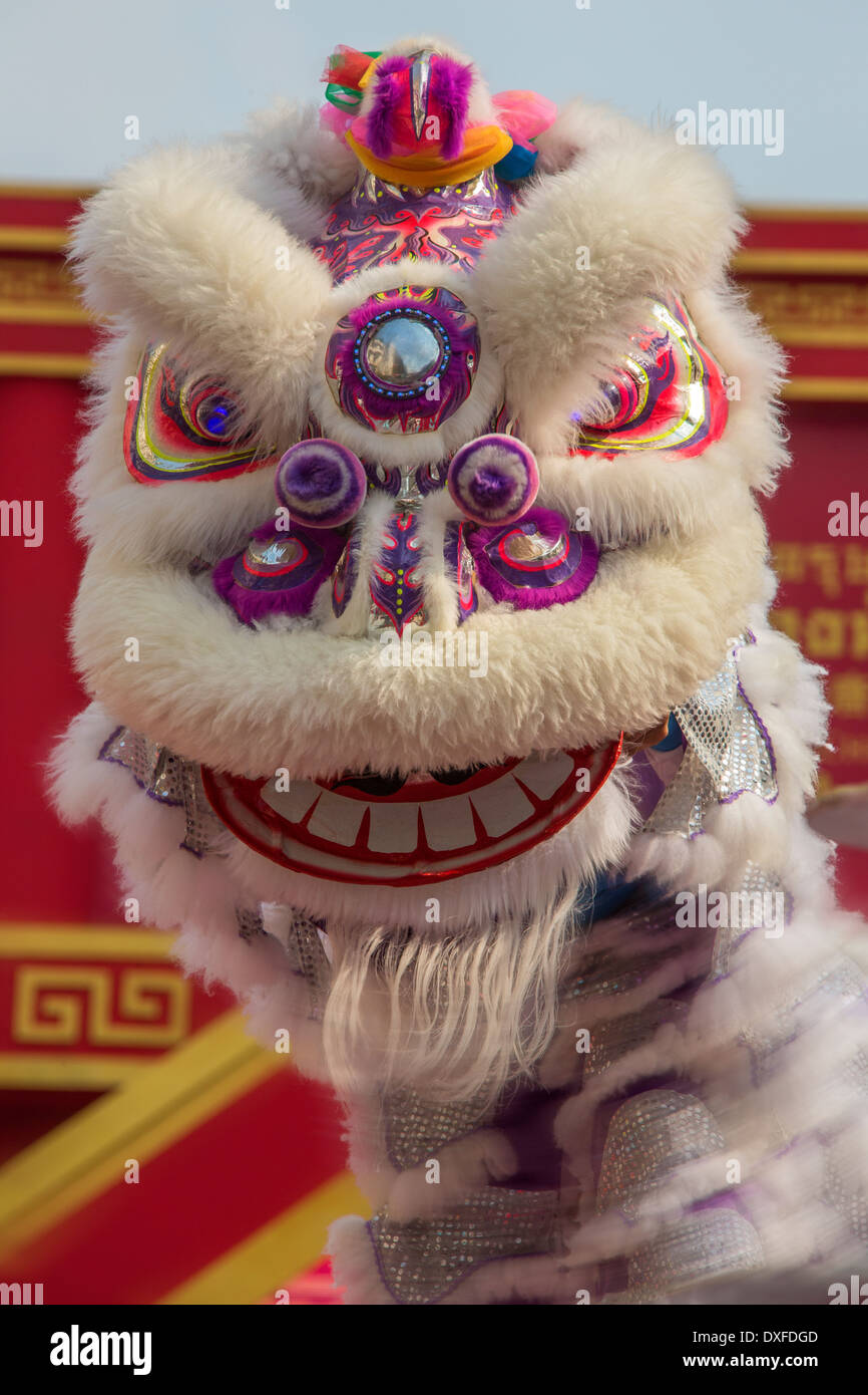 Action - Movement - Chinese Dragon Dance at the Chinese New Year celebrations in Chinatown in Bangkok in Thailand. Stock Photo