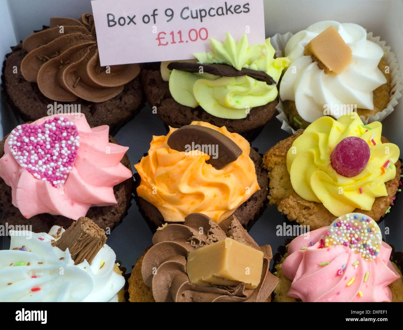 A box of 9 cup cakes for sale on a market stall in Yorkshire in the United Kingdom. Stock Photo