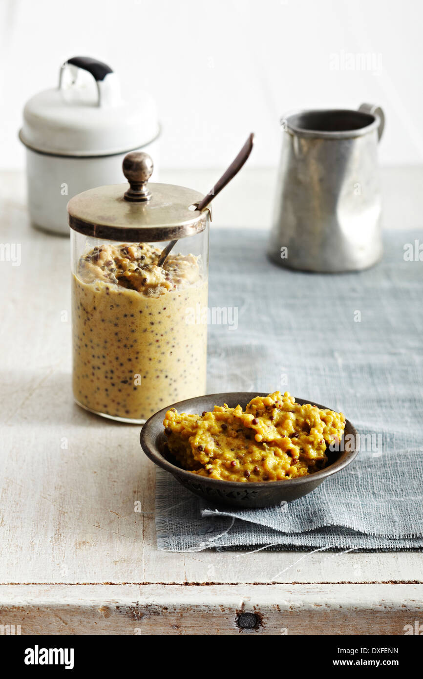 Homemade Mustard in jar and in bowl, studio shot Stock Photo