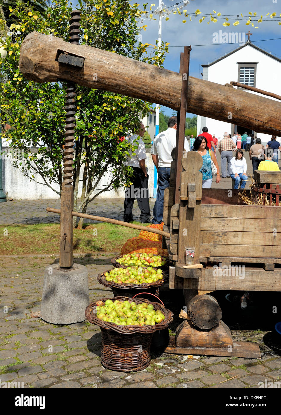 Madeira Portugal baskets of cider apples stacked in front of an old wooden cider press at the Santo De Serra cider festival Stock Photo