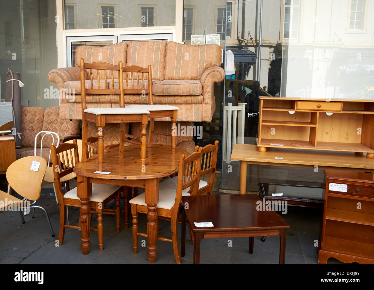 Used second hand furniture on sale on a UK high street Stock Photo - Alamy