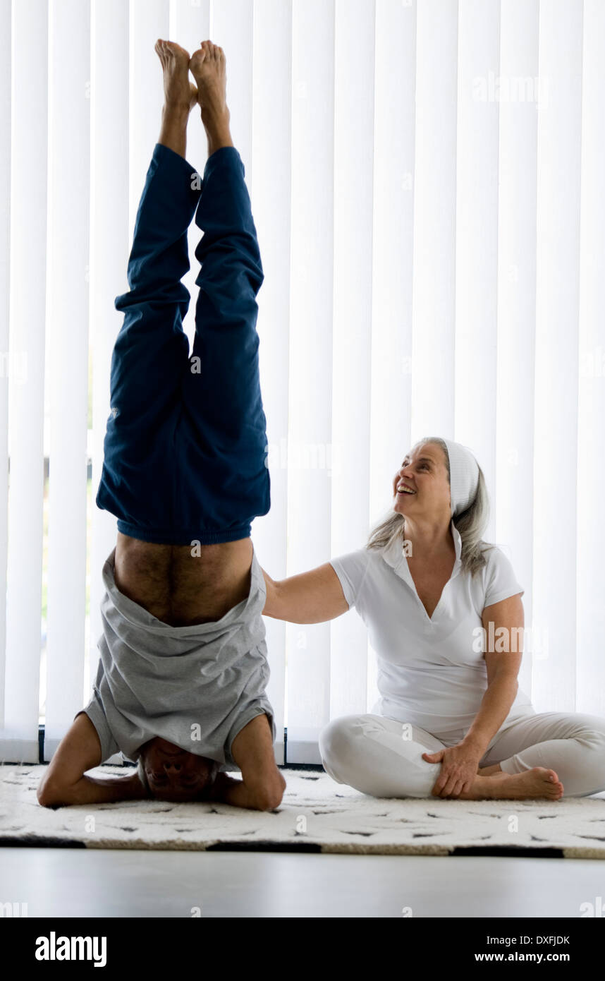 Mature couple doing yoga Stock Photo