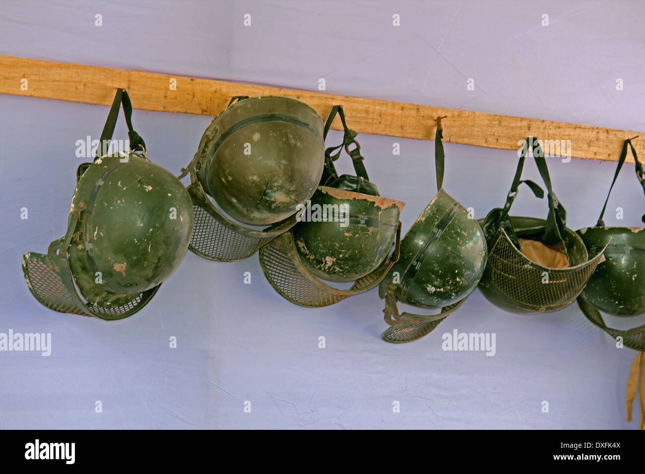 Anti Riot Police Helmets hanging at police station, india Stock Photo