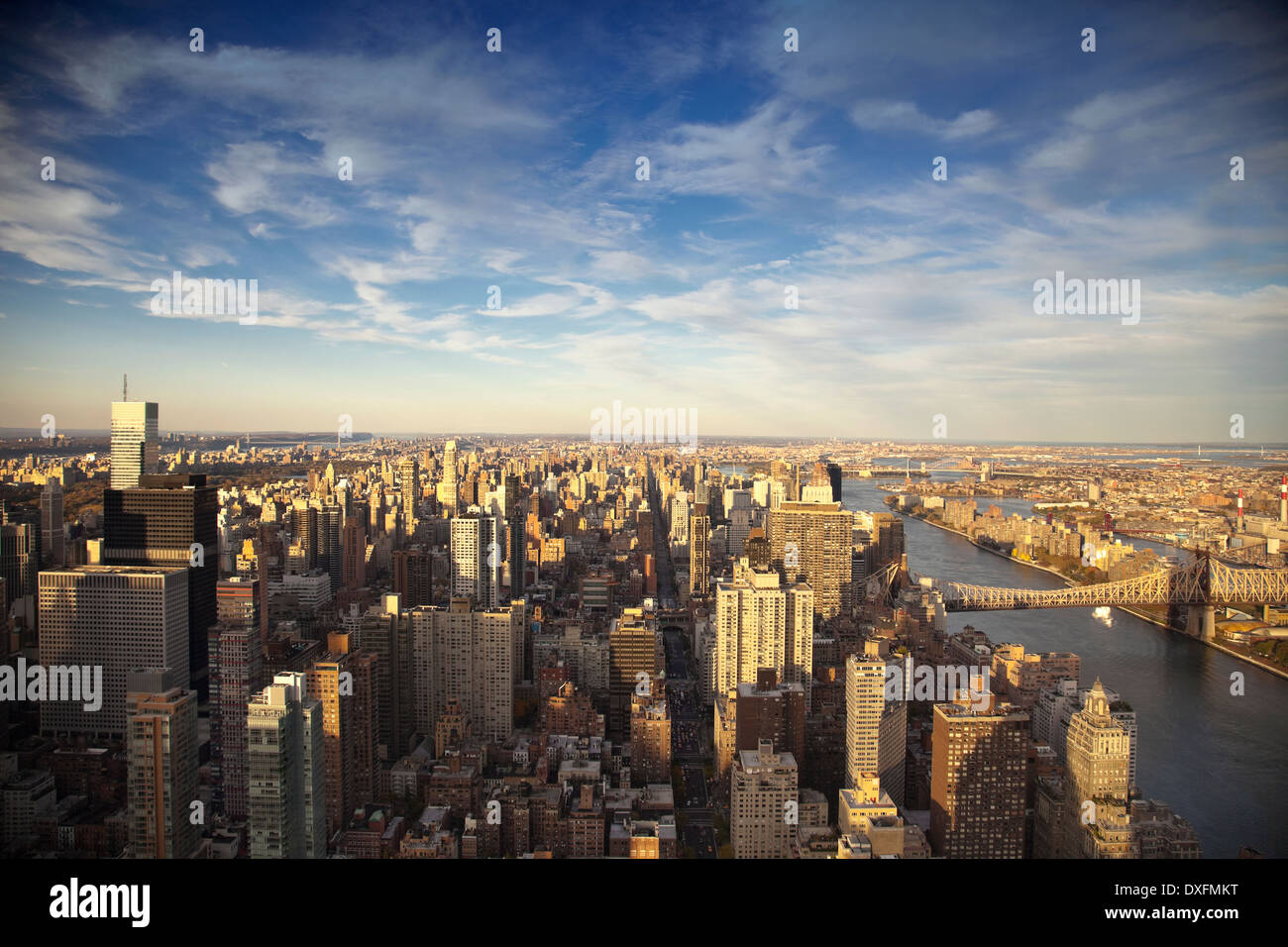 Elevated view of Manhattan at Mid-Town with East River and Queensboro Bridge at sunset. Stock Photo