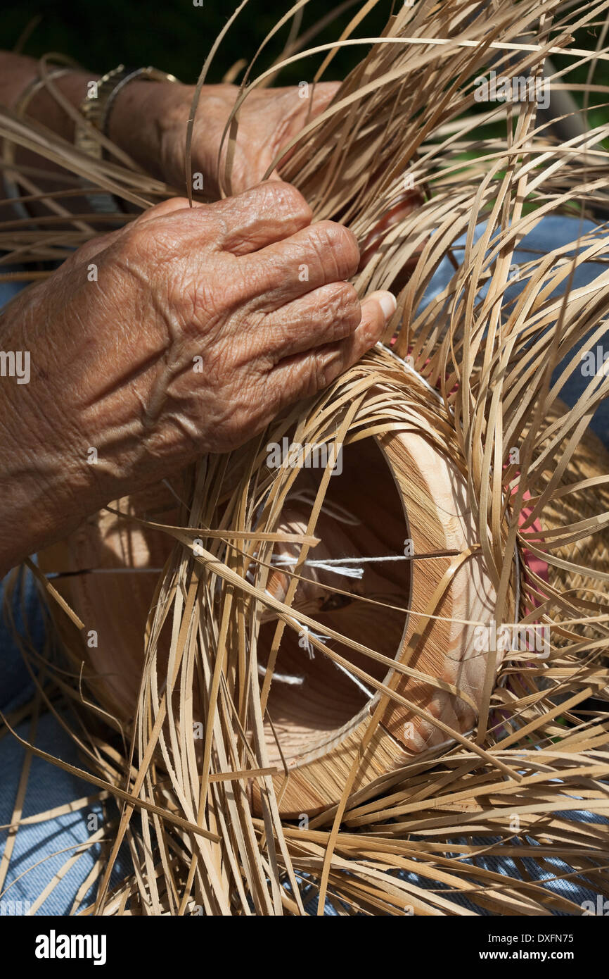 Hawaiian artisan handcrafts hat of Lauhala leaves. Stock Photo