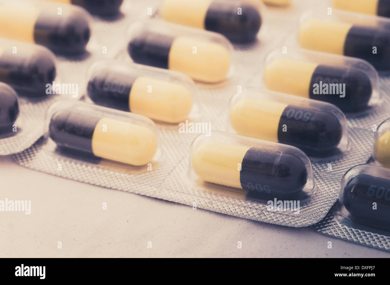 Black and yellow capsule pack medicine heath concept Stock Photo
