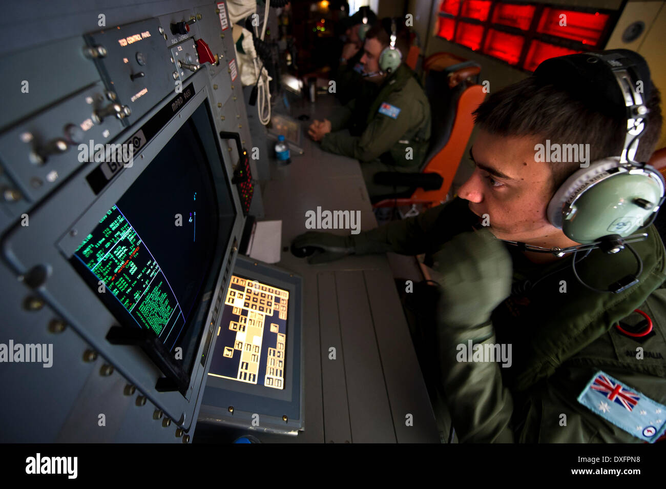 Canberra. 23rd Mar, 2014. Photo released by Australian Maritime Safety Authority on March 26, 2014 shows a crew member of an Australian aircraft conducts search operations for the missing Malaysia Airlines flight MH370 on March 23, 2014. © Australian Defense Department/Xinhua/Alamy Live News Stock Photo