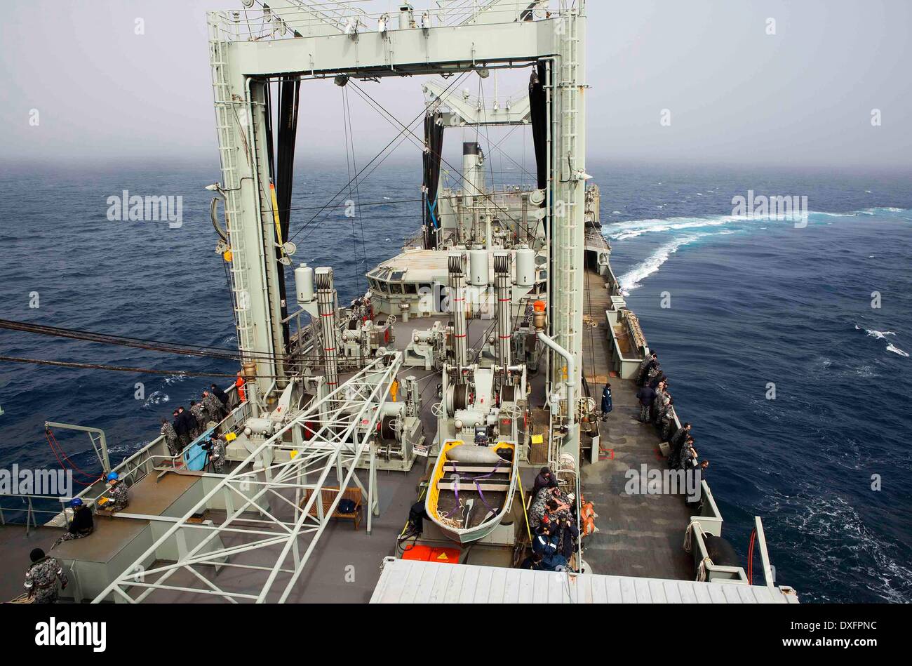 Canberra. 23rd Mar, 2014. Photo released by Australian Maritime Safety Authority on March 26, 2014 shows Australian marine personnel conduct search operations for the missing Malaysia Airlines flight MH370 on March 23, 2014. © Australian Defense Department/Xinhua/Alamy Live News Stock Photo