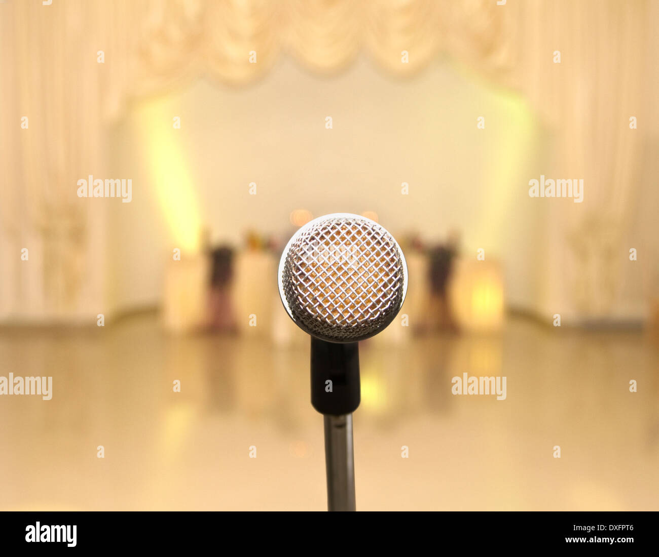 Microphone on Stage Facing Empty Auditorium Stock Photo