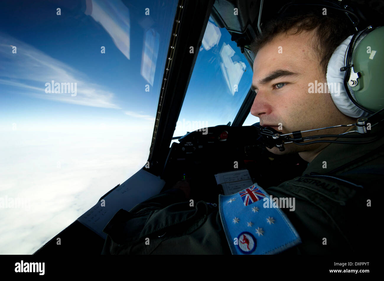 Canberra. 23rd Mar, 2014. Photo released by Australian Maritime Safety Authority on March 26, 2014 shows an Australian military pilot conducts search operations for the missing Malaysia Airlines flight MH370 on March 23, 2014. © Australian Defense Department/Xinhua/Alamy Live News Stock Photo