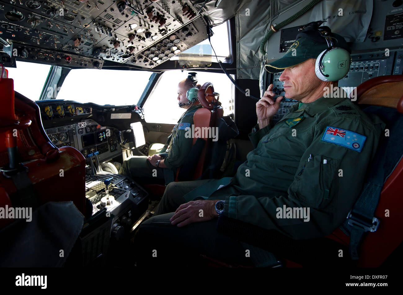 Canberra. 23rd Mar, 2014. Photo released by Australian Maritime Safety Authority on March 26, 2014 shows a crew member of an Australian aircraft conducts search operations for the missing Malaysia Airlines flight MH370 on March 23, 2014. © Australian Defense Department/Xinhua/Alamy Live News Stock Photo