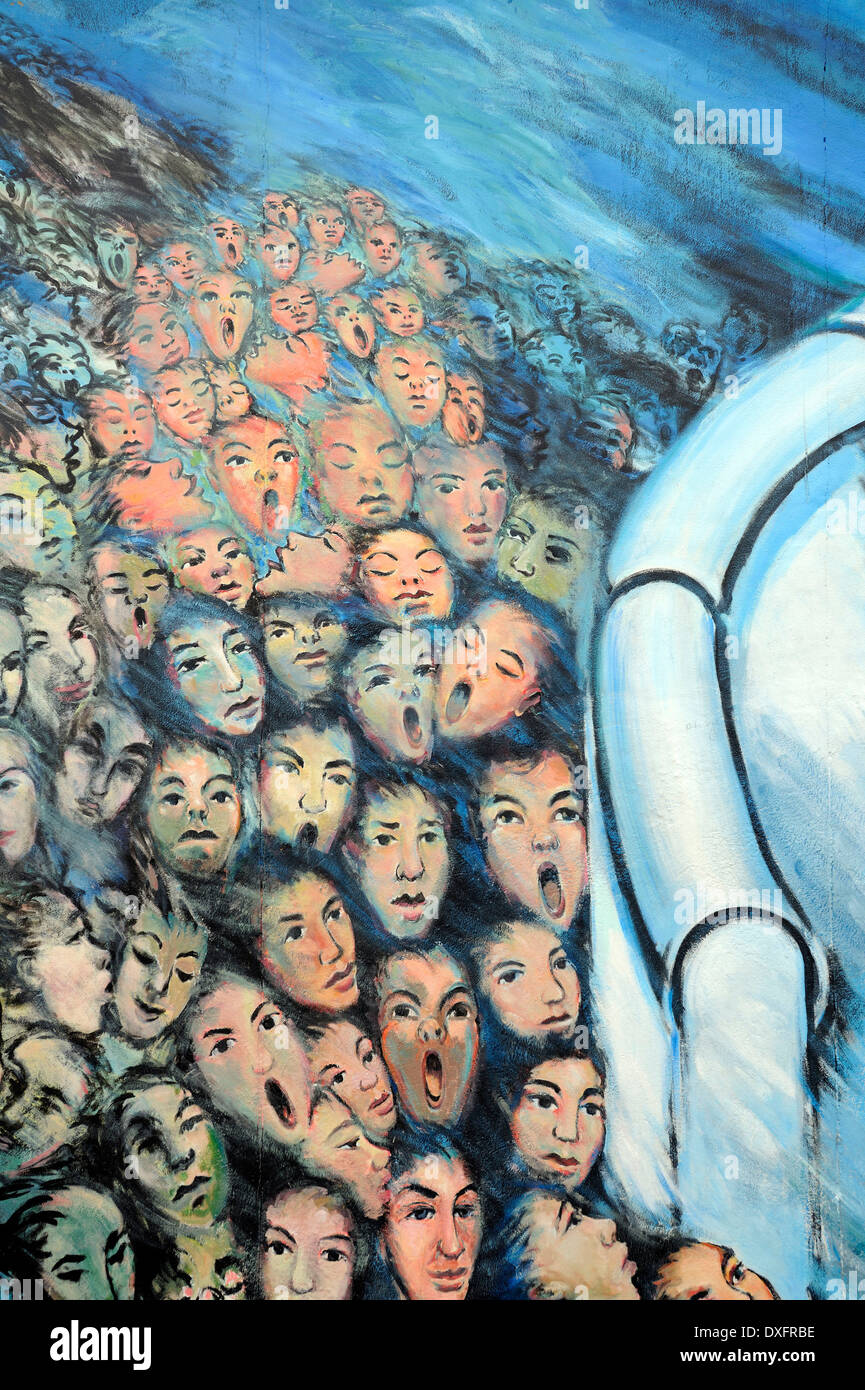 Crowd breaking through the Berlin Wall, painting on the Berlin