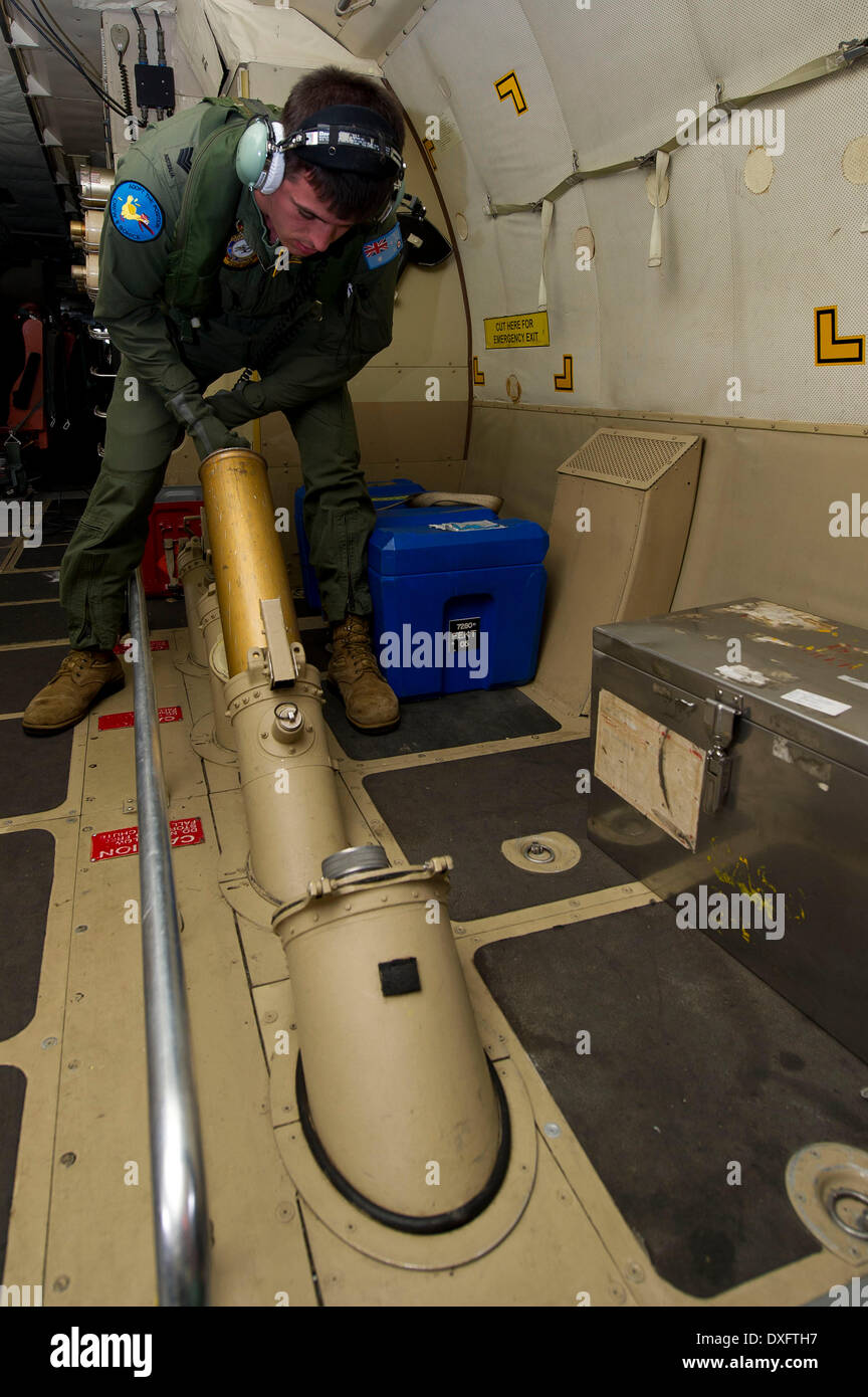 Canberra. 24th Mar, 2014. Photo released by Australian Defense Ministry on March 26, 2014 shows an expert preparing for a smoke buoy on a RAAF P-3 Orion while flying over the southern Indian Ocean during a mission to search for the missing Malaysia Airlines Flight MH370 on March 24, 2014. © Australian Defense Ministry/Xinhua/Alamy Live News Stock Photo