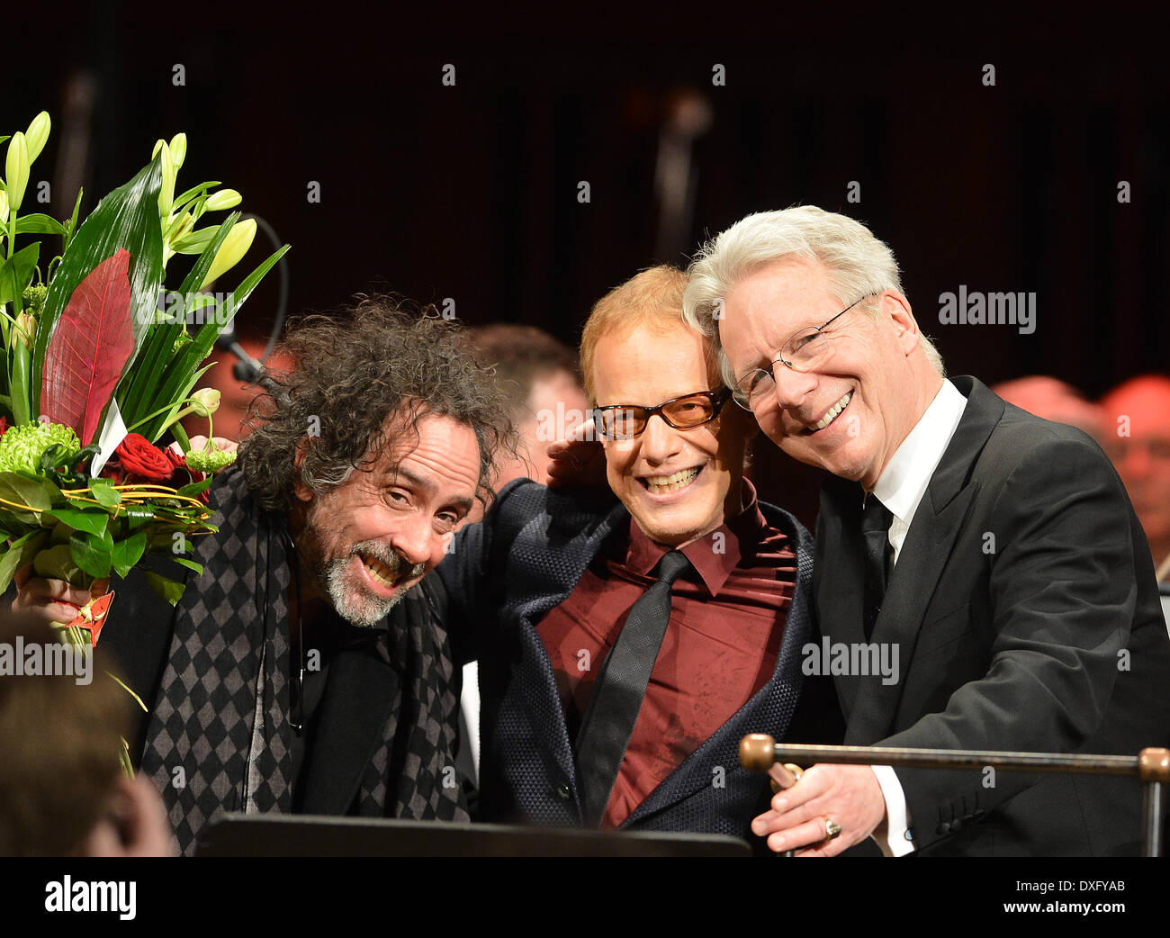 Prague, Czech Republic. 25th Mar, 2014. Composer Danny Elfman, center, US  famous filmmaker Tim Burton, left, and conductor John Mauceri react during  the concert the Danny Elfman's Music from the Films of