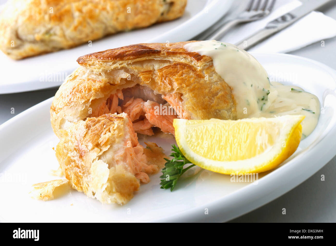 Salmon En Croute Served On Plate With Lemon Stock Photo Alamy