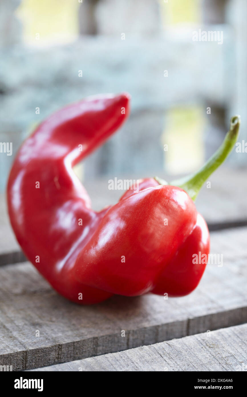 Red Romano Pepper On Wooden Surface Stock Photo