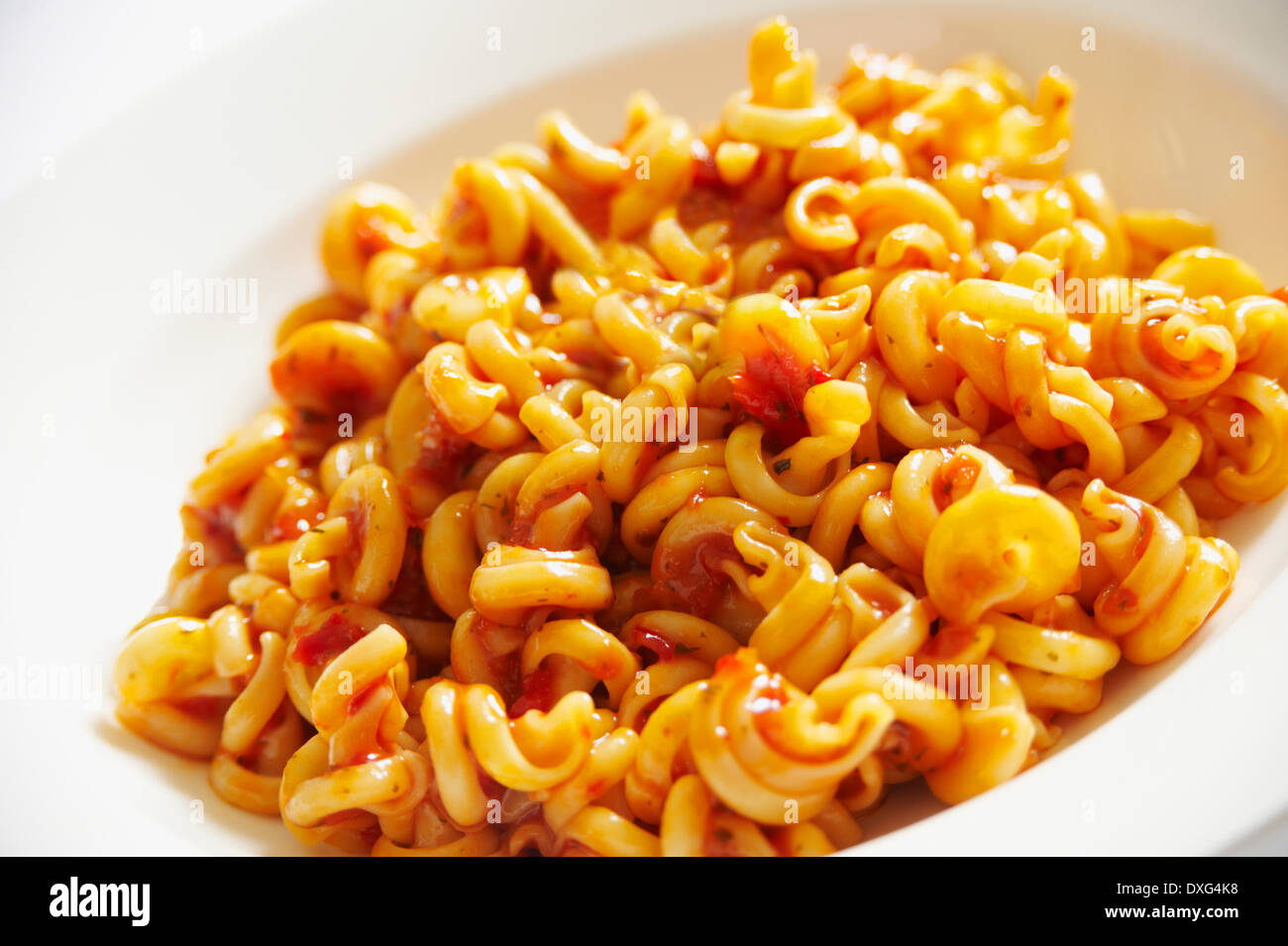 Plate Of Pasta Spirals With Tomato Sauce Stock Photo