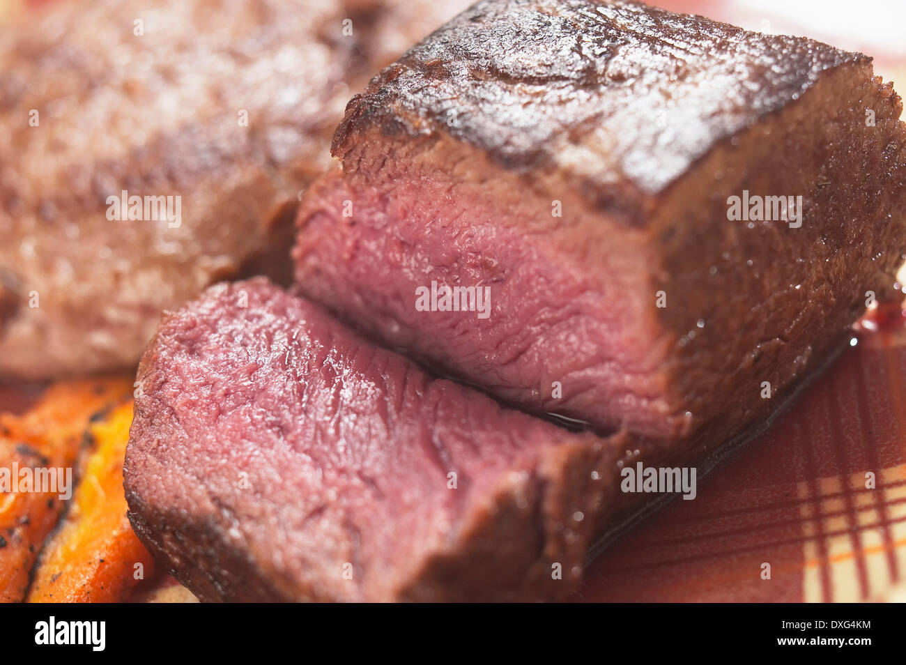 Piece Of Steak Cut To Show Colour Stock Photo