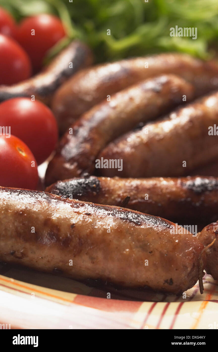 Cooked Venison Sausages On Plate Stock Photo